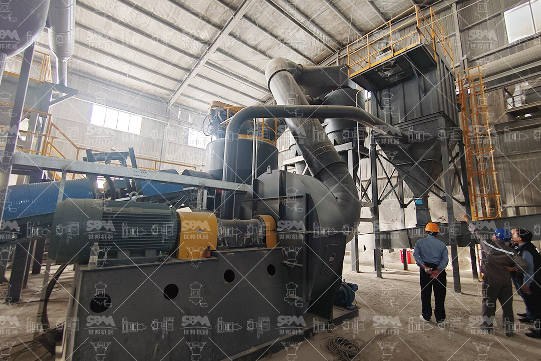 Barite mining site with heavy machinery extracting raw ore for drilling fluid production